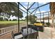 Enjoy the golf course view from this relaxing screened patio at 2064 Edenton Ter, The Villages, FL 32162