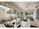 Bright sunroom with comfortable seating and natural light at 2064 Edenton Ter, The Villages, FL 32162