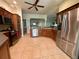 Spacious kitchen with stainless steel appliances, ample counter space, and tile flooring at 2071 Westchester Way, The Villages, FL 32162