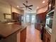 Well-equipped kitchen with wood cabinets, stainless steel appliances, and tile floors at 2071 Westchester Way, The Villages, FL 32162
