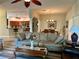 Inviting living room with an open layout, stylish sofas, and wood-look flooring at 2071 Westchester Way, The Villages, FL 32162
