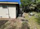 Spacious backyard with potential, featuring an AC unit and additional yard space at 2107 Hollywood Ave, Eustis, FL 32726
