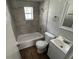 Updated bathroom with new tiled walls, shower head, and vanity at 2107 Hollywood Ave, Eustis, FL 32726