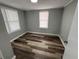 Cozy bedroom with ample light and hardwood floors at 2107 Hollywood Ave, Eustis, FL 32726