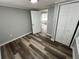 Bedroom featuring a closet and hardwood floors at 2107 Hollywood Ave, Eustis, FL 32726