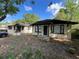 The property contains two single story homes, each featuring a covered front porch at 2107 Hollywood Ave, Eustis, FL 32726