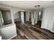 Spacious living room featuring an open concept and lots of natural light from multiple windows at 2107 Hollywood Ave, Eustis, FL 32726