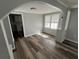 Cozy living room with ample natural light and wood-look floors at 2107 Hollywood Ave, Eustis, FL 32726