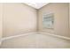 A bright, empty bedroom features a ceiling fan and a large window at 223 Crepe Myrtle Dr, Groveland, FL 34736