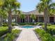 Inviting community space with a charming water feature surrounded by manicured landscaping and lounge seating at 223 Crepe Myrtle Dr, Groveland, FL 34736