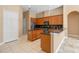 Spacious kitchen featuring granite countertops, stainless steel appliances, and island at 223 Crepe Myrtle Dr, Groveland, FL 34736