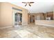 Expansive living area with seamless access to outdoor living space and a breakfast bar at 223 Crepe Myrtle Dr, Groveland, FL 34736