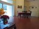 Bright dining room with wood floors and a view of the pool at 223 Lady Diana Dr, Davenport, FL 33837