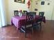Close up of dining room table with chairs and flowers in vase at 223 Lady Diana Dr, Davenport, FL 33837