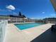 Community swimming pool featuring a well-maintained deck and clear blue water on a sunny day at 223 Lady Diana Dr, Davenport, FL 33837
