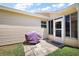 Back patio area, perfect for outdoor dining or relaxing, and well-maintained yard at 2290 Due West Dr, The Villages, FL 32162