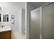 Bathroom featuring a shower, vanity with sink, and ample lighting at 2290 Due West Dr, The Villages, FL 32162