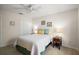 Bedroom with large closet doors, side tables with lamps, and carpet flooring at 2290 Due West Dr, The Villages, FL 32162