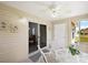 Relaxing sunroom features tile floors, a ceiling fan, and a view to the outdoors at 2290 Due West Dr, The Villages, FL 32162