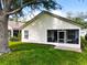 Charming single-story home featuring a screened lanai and expansive backyard, perfect for outdoor living at 25044 Cranes Roost Cir, Leesburg, FL 34748