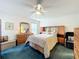 Cozy bedroom with a ceiling fan and a matching dresser set at 25044 Cranes Roost Cir, Leesburg, FL 34748