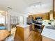 Open kitchen with stainless steel appliances, an island, and a view to the dining area at 25044 Cranes Roost Cir, Leesburg, FL 34748