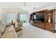 Relaxing living room with a ceiling fan and access to the lanai at 25044 Cranes Roost Cir, Leesburg, FL 34748