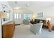 The spacious living room offers a cozy atmosphere with plush carpeting and bright walls at 25044 Cranes Roost Cir, Leesburg, FL 34748