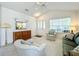 Living room featuring plush carpeting, bright walls and white ceilings at 25044 Cranes Roost Cir, Leesburg, FL 34748