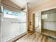 Bathroom features glass enclosed shower and mirrored closet that leads to a second shower at 25540 Belle Helene, Leesburg, FL 34748