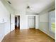 Bedroom featuring hardwood floors, a ceiling fan, with natural lighting coming from the two windows at 25540 Belle Helene, Leesburg, FL 34748