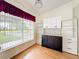 Bright dining room with natural light, wood floors, and custom built in cabinetry at 25540 Belle Helene, Leesburg, FL 34748