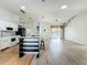 Open concept kitchen, with stainless appliances, a bar area, and lighting fixtures at 25540 Belle Helene, Leesburg, FL 34748