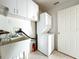 Laundry room with side-by-side washer/dryer and utility sink at 25540 Belle Helene, Leesburg, FL 34748