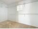 Spacious walk-in closet with ample shelving and a small window, providing plenty of storage space at 25540 Belle Helene, Leesburg, FL 34748