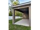 Covered back patio overlooking the backyard at 27 Perch Dr, Kissimmee, FL 34759