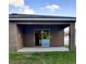 Covered back patio overlooking the yard at 27 Perch Dr, Kissimmee, FL 34759
