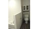 Neutral bathroom with white toilet and vanity at 27 Perch Dr, Kissimmee, FL 34759