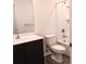 Clean bathroom with dark wood vanity, white sink, toilet and shower with tub at 27 Perch Dr, Kissimmee, FL 34759