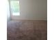 Bedroom with light-colored carpet, a window overlooking the outside at 27 Perch Dr, Kissimmee, FL 34759