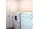 A laundry room with a standard-sized washer and dryer set at 27 Perch Dr, Kissimmee, FL 34759