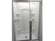 This modern shower is bright white and has sliding glass doors at 27 Perch Dr, Kissimmee, FL 34759