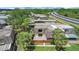Aerial view of the townhouse complex, highlighting lush landscaping and private patios at 2934 Tangerine Ct, Leesburg, FL 34748