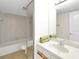Bathroom with a shower/tub, vanity with towels, and tile floor at 2934 Tangerine Ct, Leesburg, FL 34748