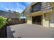 Charming patio with gray concrete flooring and a privacy fence perfect for outdoor relaxation and entertaining at 2934 Tangerine Ct, Leesburg, FL 34748