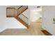 Beautiful staircase, visible from the home's entrance, offers a glimpse into the living room, highlighting the tile floor at 2934 Tangerine Ct, Leesburg, FL 34748