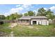 Spacious backyard with a lawn, shed, and a screened porch at 30641 County Road 435, Sorrento, FL 32776