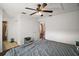 Bedroom features a ceiling fan and hardwood floors, with ensuite bathroom at 30641 County Road 435, Sorrento, FL 32776