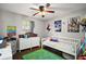 Bright bedroom with a wood ceiling fan, a window with blinds, and decorated with character posters at 30641 County Road 435, Sorrento, FL 32776