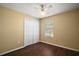 Neutral bedroom with a ceiling fan, closet and window with mini blinds at 30641 County Road 435, Sorrento, FL 32776